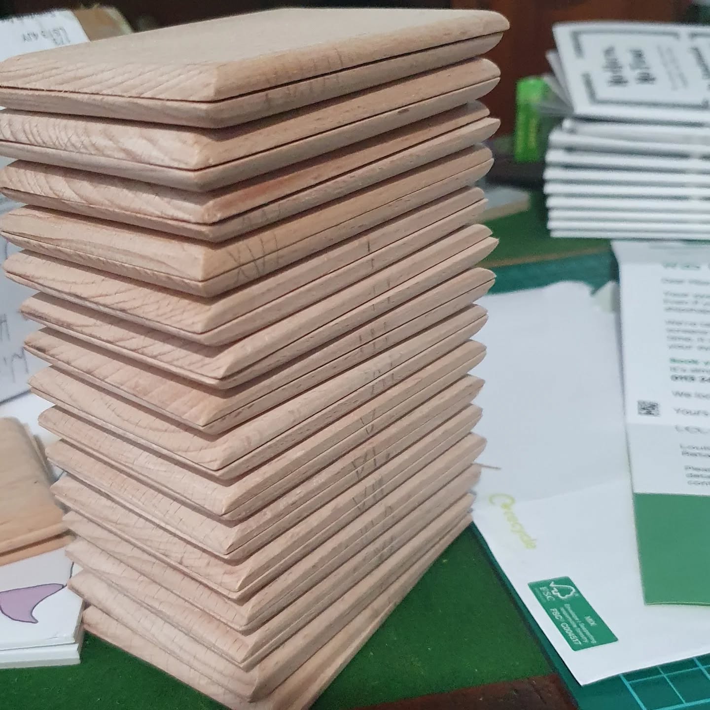 The shaped boards have arrived in my studio from @fiftyelevencabinetry now I must chisel channels into them, and prepare pages for my upcoming class to sew. Have pity on my poor over worked shoulders 😅

(Also visible in this picture, a pile of rpg chapbooks getting prepped for my next fair, and admin because the many sides of my work keep spinning).

[Image description: a stack of shaped wooden book boards on a desk with some folded pamphlets and envelopes.]