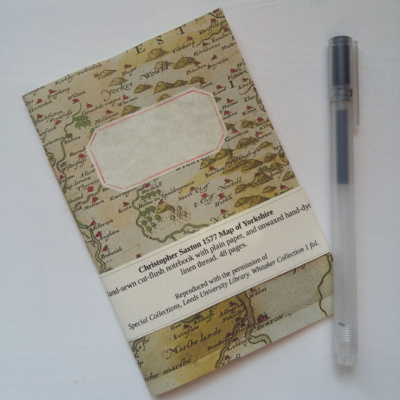 A notebook with an old map image on the cover