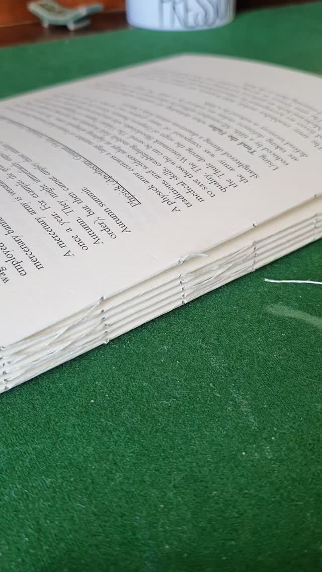 There are a few ways to join thread to continue sewing, this is mine. The knot is formed on the finger then slides onto the end of your thread and as you tighten, locks into place so you can keep sewing. If it doesn't work, it slips off and you can try again.

[Image description, thread is placed in front of the index finger, then wrapped over the finger then behind the starting thread and up over the finger again to form an X on the side of finger. The wrapping continues to the back until the starting thread and wrapped thread can be held between the second finger and thumb. The index finger should then have 2 parallel thread loops on it. Pull the left loop over the right one and remove everything from the finger without tightening. This should create a large loop with an open knot just below it. Thread the loop over the thread you want to extend, then tighten. If it unravels, remake your loops and try again.]