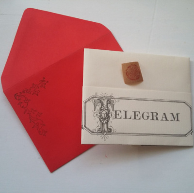 A folder telegram with envelope and sticker