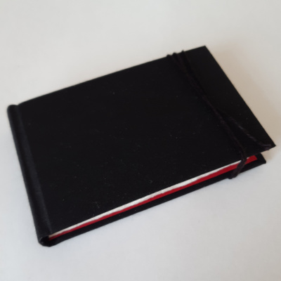 A black sketchbook with linen tie