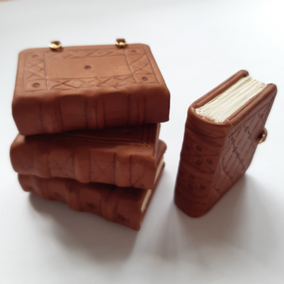 Four miniature blind tooled medieval style books