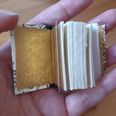 Miniature book with gold endpapers