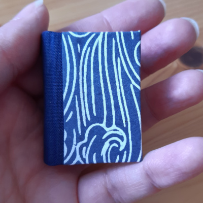 miniature book in blue and white wave pattern