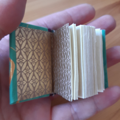 miniature book with brass endpapers