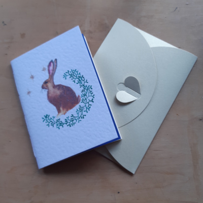 A pamphlet with a hare on and an envelope