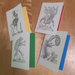 Four A6 white pamphlets each with a different monster image on in black and white and different endpapers in green, yellow, red, and blue