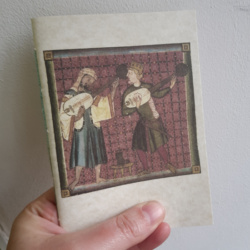 A pamphlet with an image of two musicians playing lutes on, one with a turban, one bare-headed