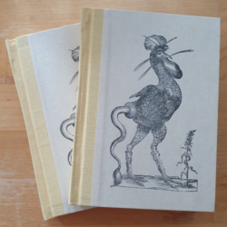 Two hardback books with pale yellow book cloth spines and white parchment effect paper covers. The covers feature a woodcut image of a "monstrous chicken" which looks like a chicken with a cow's tail.