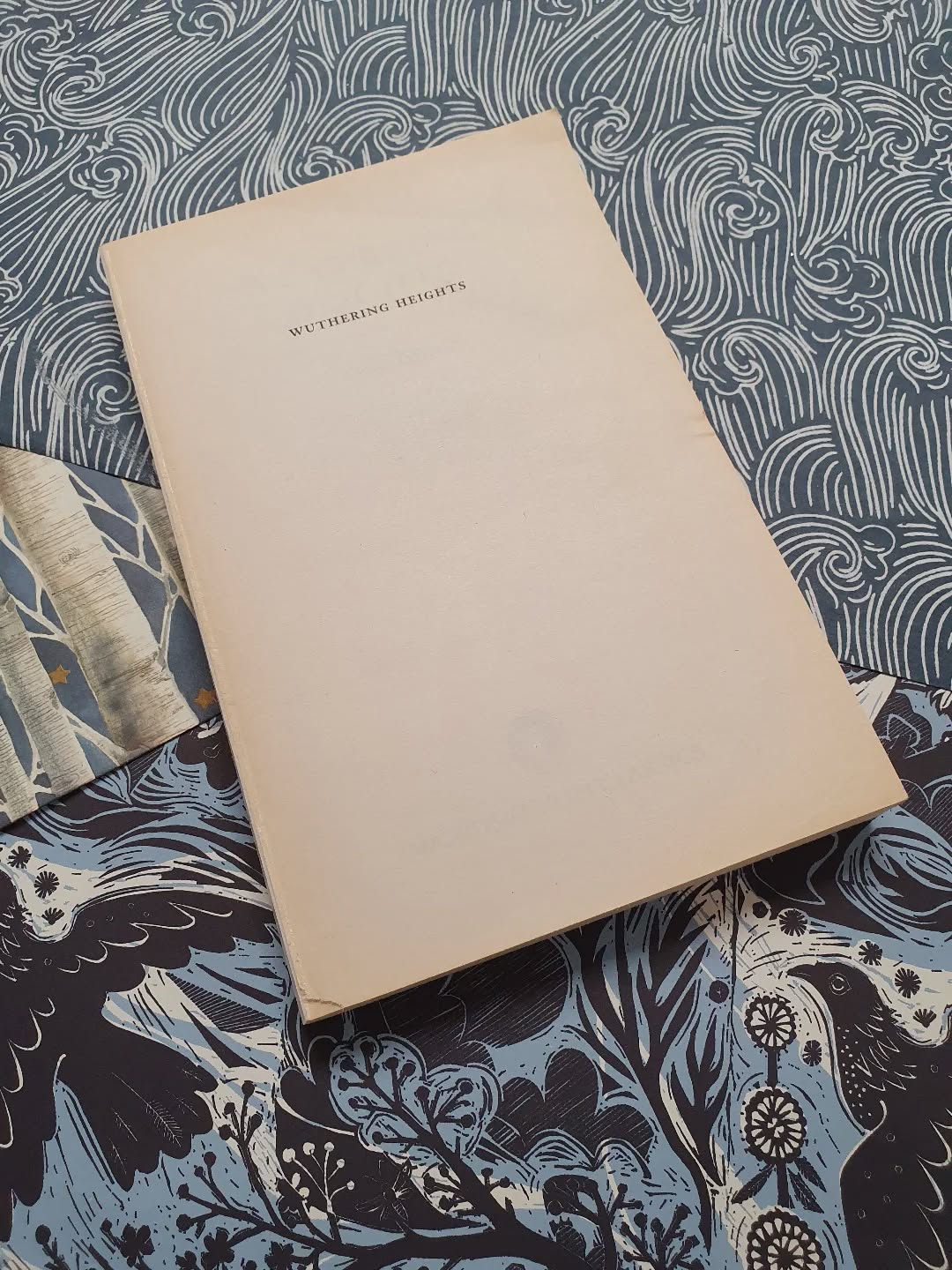 Another #PaperbackToHardback binding in the works. Trying to decide on papers using the same rules as my previous paperback books, no buying new, it must all come from the stash. Looks like I have some solid choices at least.

[Image description: a book without a cover sitting on three decorative papers.]