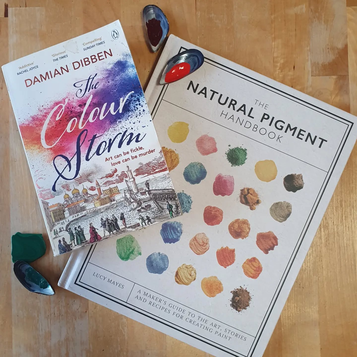 Sunday shelfie time, what's on my medievalist bookbinder's shelf today? 

Fiction: the Colour Storm by Damian Dibben. This one was actually suggested to me at a craft fair and I'm so glad they did. An interesting portrayal of Italian art studios along with the preparation required to make the paints. Plus some intrigue along the way. Did not expect the ending and really enjoyed this read.

Non-fiction: The Natural Pigment Handbook. A newish book to me on pigment making, thorough, well laid out. I look forward to investigating the recipes further.

[Image description: two books laid on a table with some sea shell paint pots and a slice of malachite.]